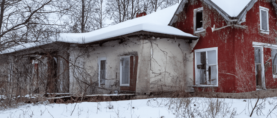 Home covered with snow during winter, symbolizing common winter home problems.