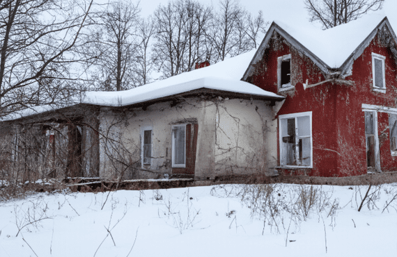 Home covered with snow during winter, symbolizing common winter home problems.